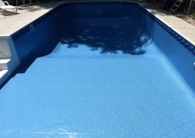 A brand new pool liner installation going from the shallow end to the deep end.
