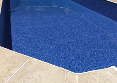 A new pool liner with water filling the pool to finish the process.
